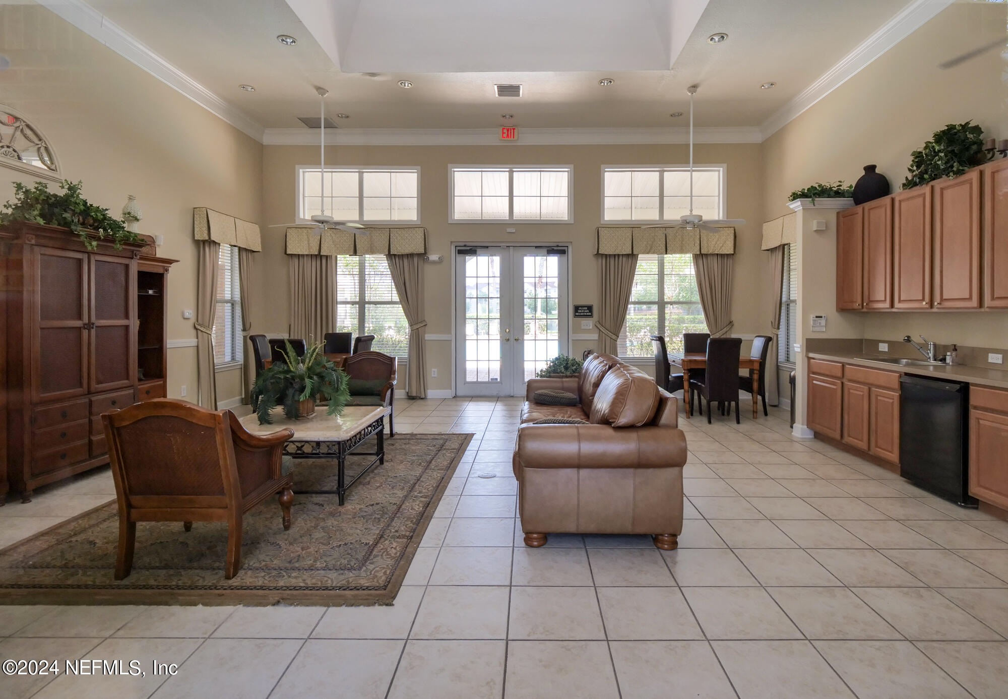 7801 Point Meadows Drive, Unit 5202 Jacksonville, FL 32256 - Photo 33 of 34 a living room with furniture and a large window
