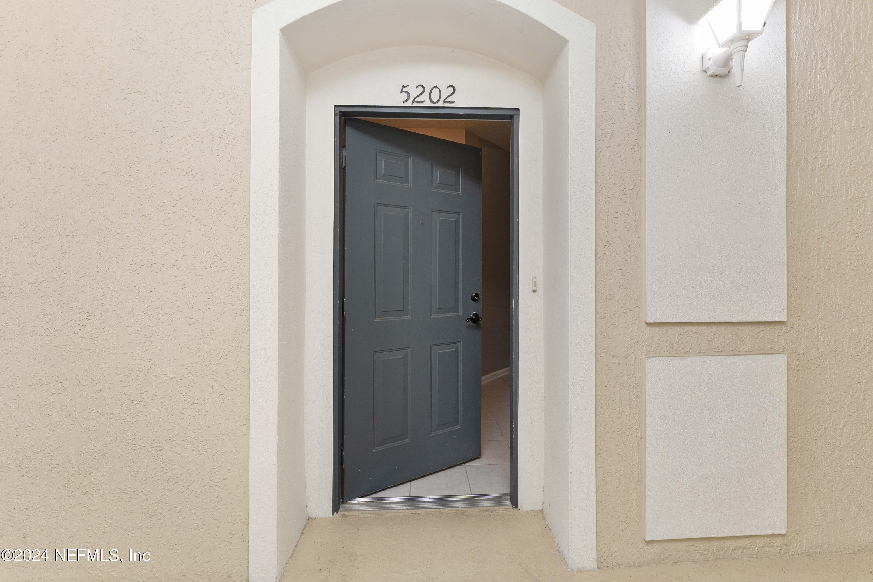 7801 Point Meadows Drive, Unit 5202 Jacksonville, FL 32256 - Photo 8 of 34 a view of a hallway with closet