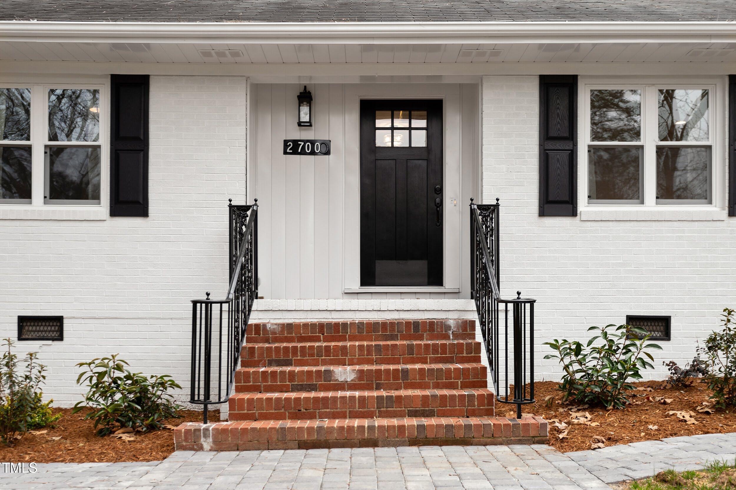 2700 University Drive, Unit B Durham, NC 27707 - Photo 1 of 17 a front view of a house with a yard