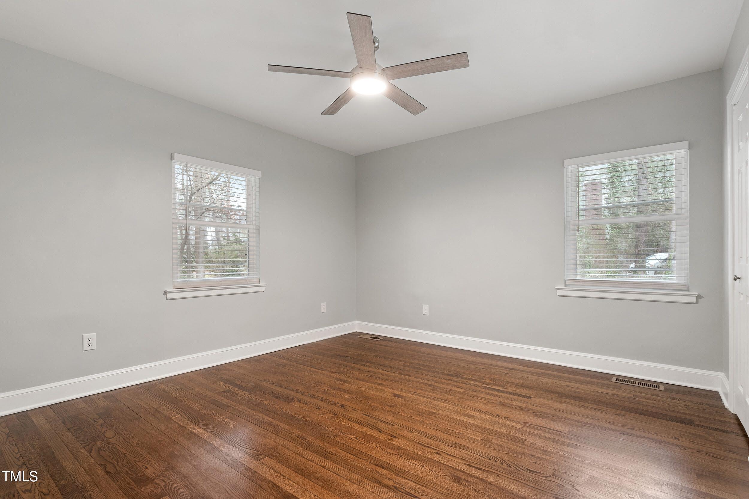 2700 University Drive, Unit B Durham, NC 27707 - Photo 11 of 17 a view of empty room with wooden floor and fan