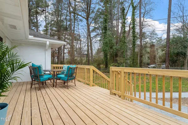 a view of a two chairs on deck with wooden floor