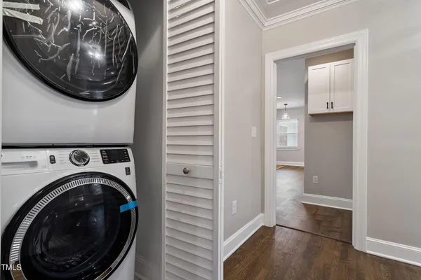 a view of a hallway with washer and dryer