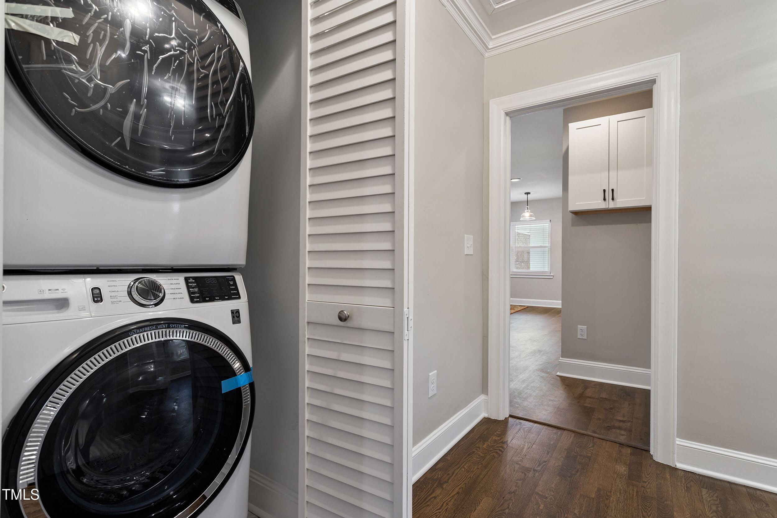 2700 University Drive, Unit B Durham, NC 27707 - Photo 7 of 17 a view of a hallway with washer and dryer