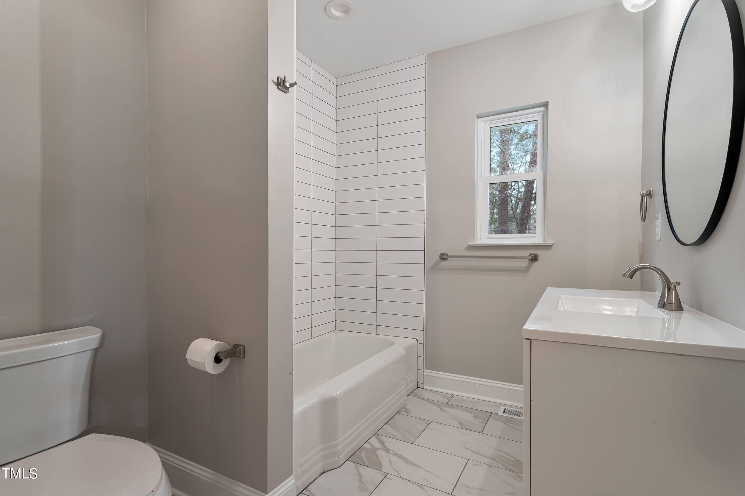 2700 University Drive, Unit B Durham, NC 27707 - Photo 10 of 17 a bathroom with a sink toilet and tub