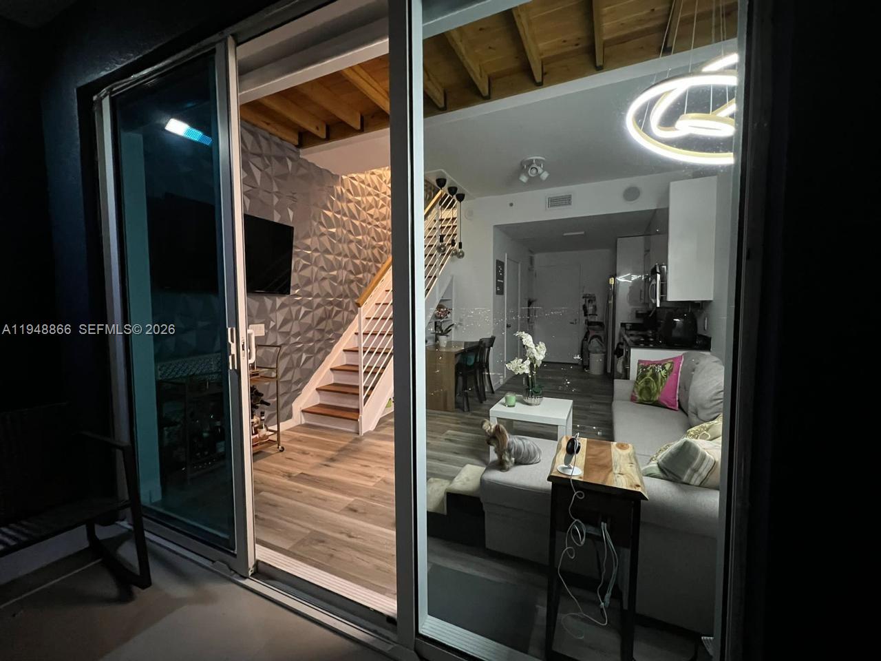 60 Southwest 13th Street, Unit 3013 Miami, FL 33130 - Photo 6 of 26 a view of a hallway and a livingroom with furniture