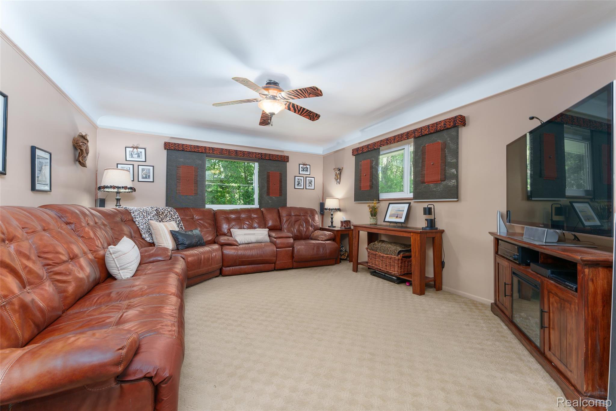 2172 Devonshire Road Bloomfield Hills, MI 48302 - Photo 17 of 45 Carpeted living area featuring painted walls and crown molding