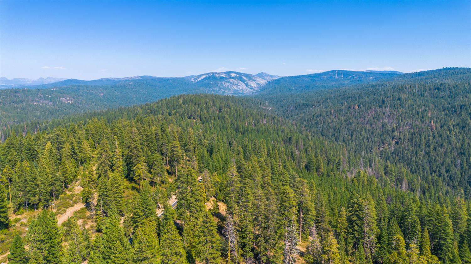 26650 Old Mono Road Long Barn, CA 95335 - Photo 6 of 7 a view of a lush green hillside and a mountain