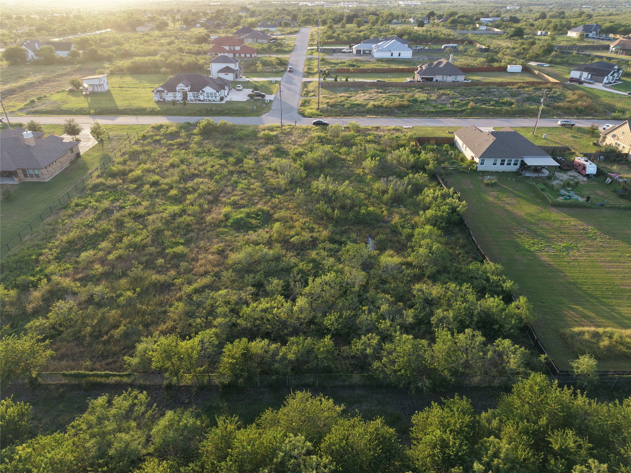 232 East Ridge Lane Kyle, TX 78640 - Photo 9 of 36 An aerial perspective reveals a verdant lot nestled within a residential landscape.