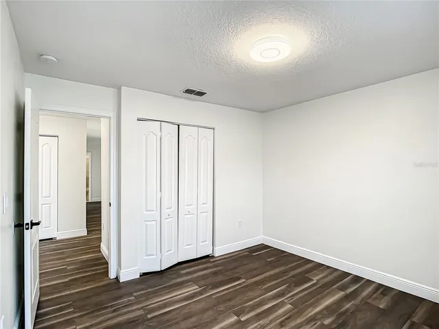a view of a livingroom with wooden floor