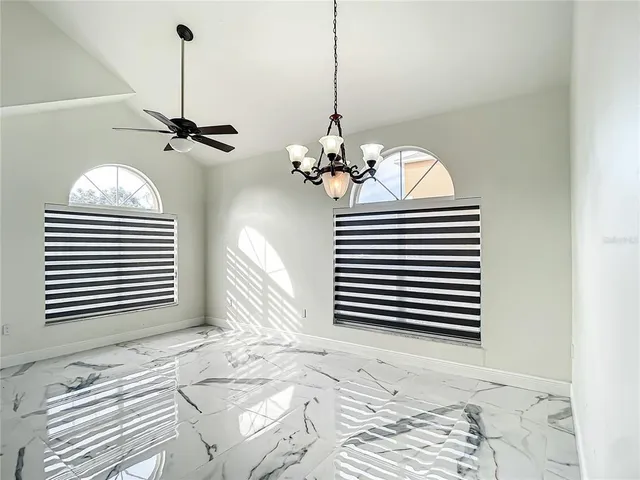 a view of a chandelier and a bedroom