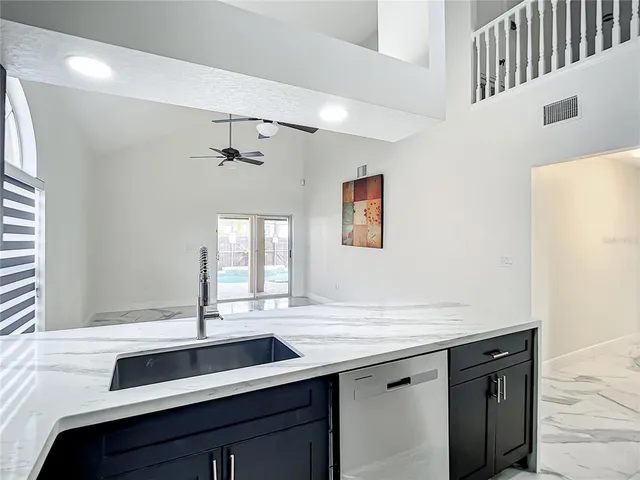 a bathroom with a sink and a large mirror