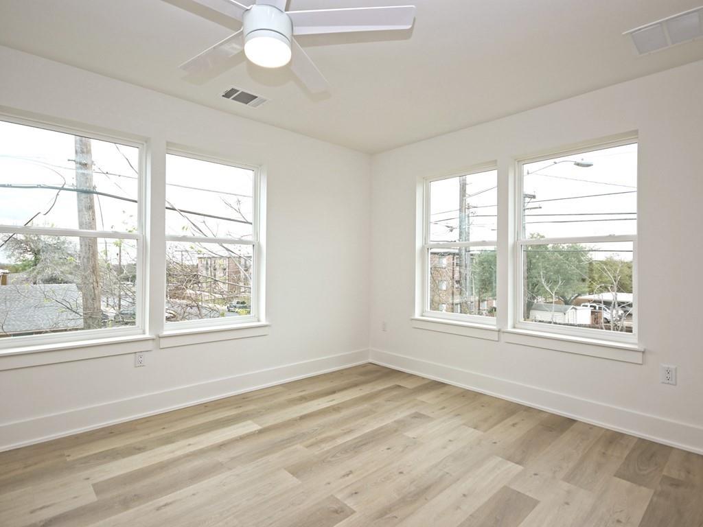 1116 Atkinson Road Austin, TX 78752 - Photo 18 of 27 a view of an empty room with a window