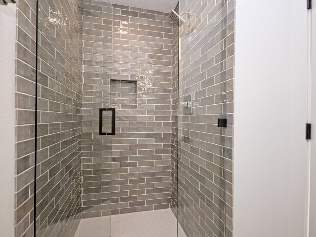 1116 Atkinson Road Austin, TX 78752 - Photo 20 of 27 a bathroom with a shower