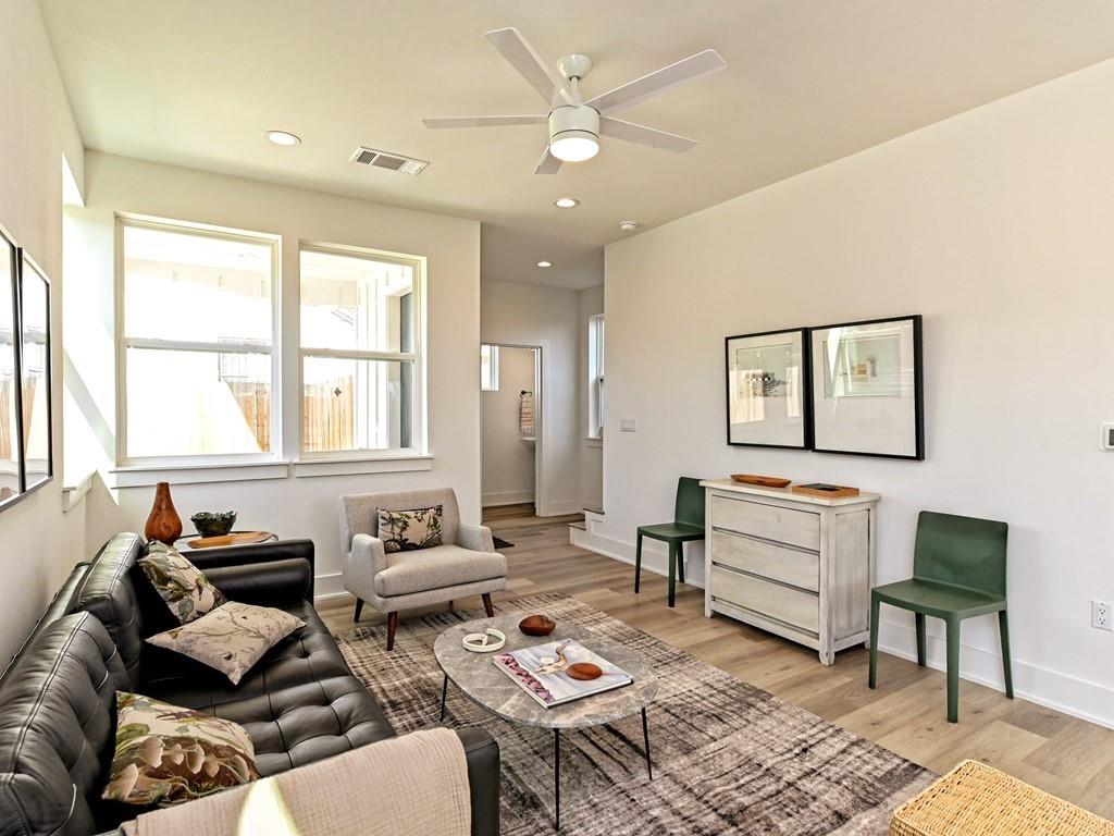 1116 Atkinson Road Austin, TX 78752 - Photo 4 of 27 a living room with furniture a rug and a window
