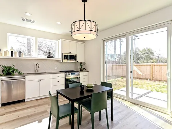 a view of a dining room with furniture window and outside view