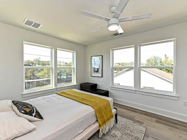 a bedroom with a bed and a window