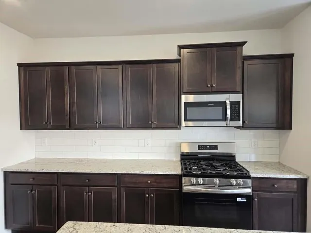 a bathroom with a toilet and a bathtub