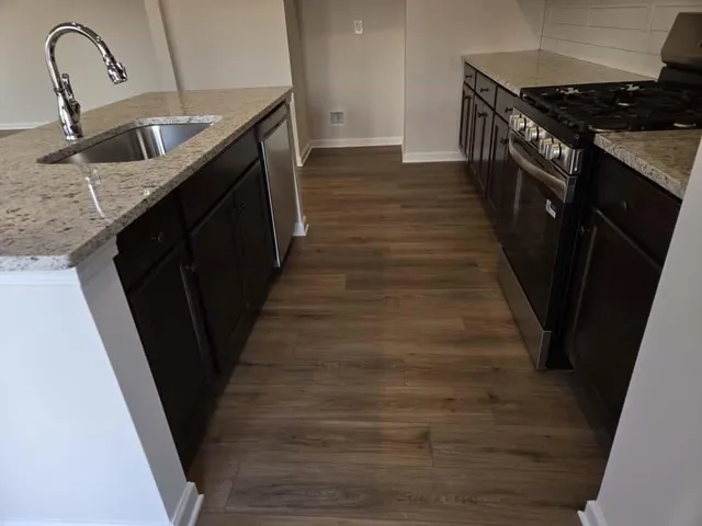 a bathroom with a sink a toilet and bathtub