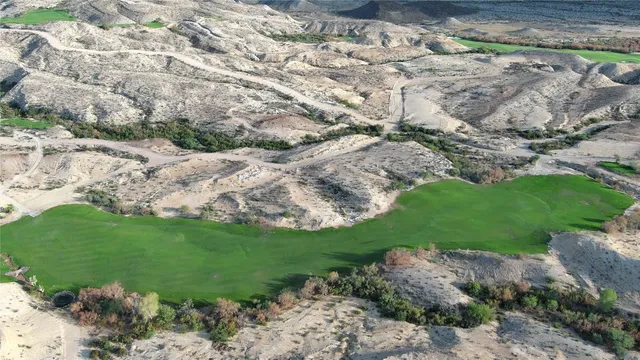 a view of a street with a yard