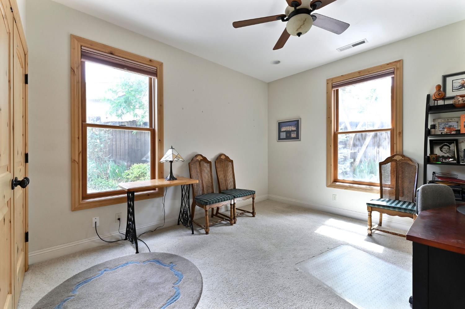 281 Oak Tree Circle Murphys, CA 95247 - Photo 14 of 96 a view of a livingroom with workspace and a window