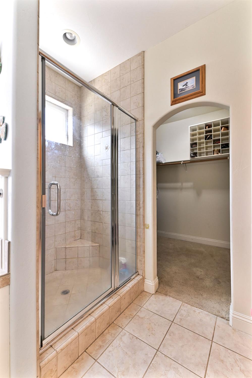 281 Oak Tree Circle Murphys, CA 95247 - Photo 25 of 96 a bathroom with a shower and a sink