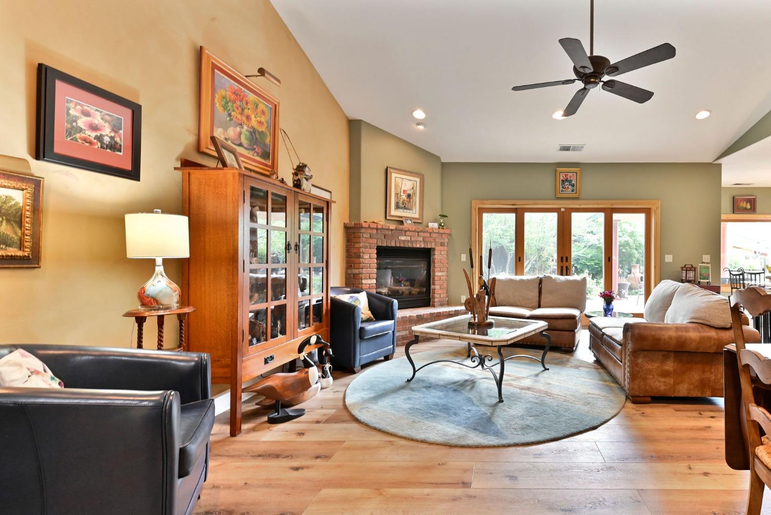281 Oak Tree Circle Murphys, CA 95247 - Photo 33 of 96 a living room with fireplace furniture and a large window