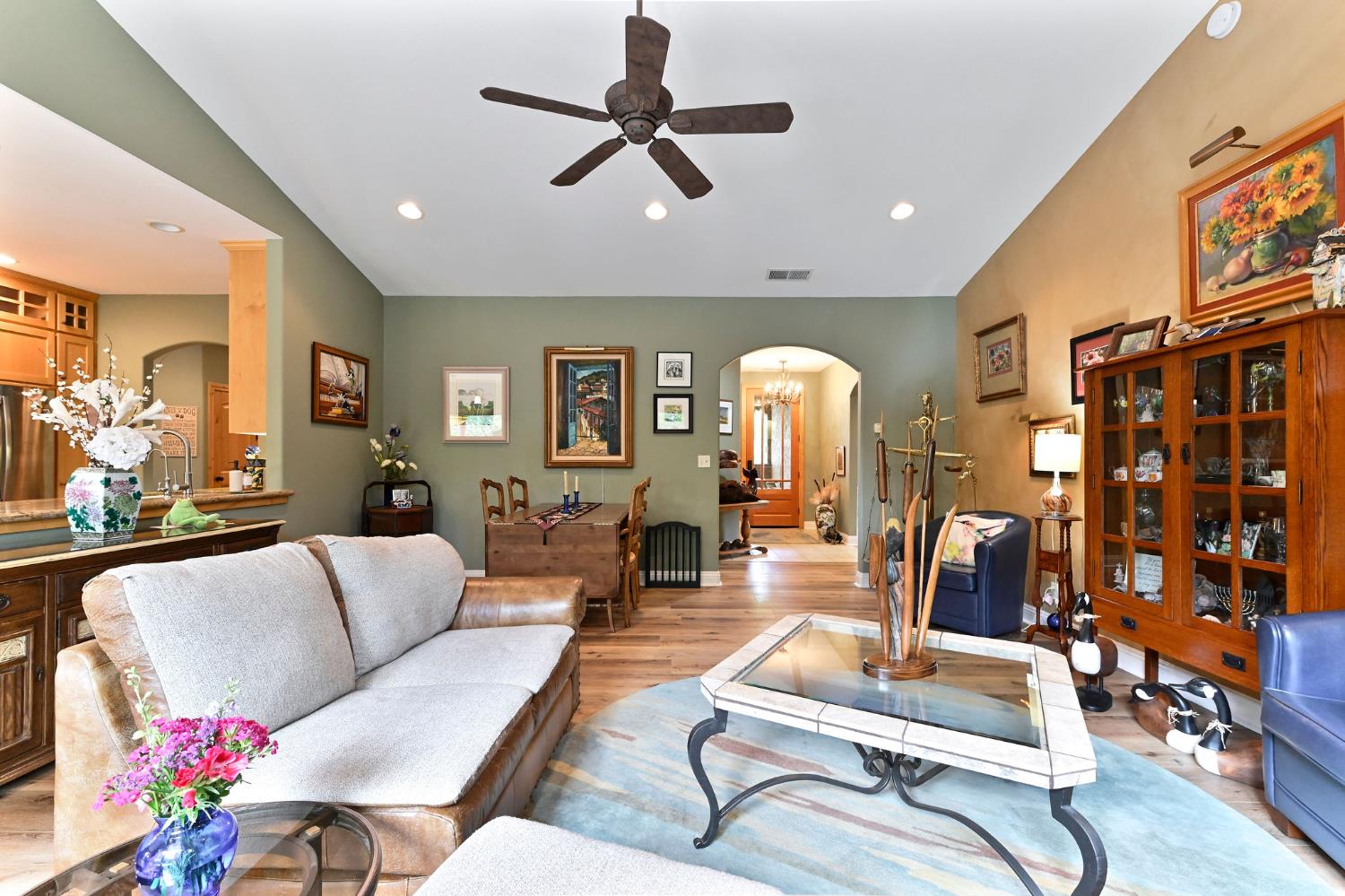 281 Oak Tree Circle Murphys, CA 95247 - Photo 35 of 96 a living room with furniture gym equipment and a chandelier
