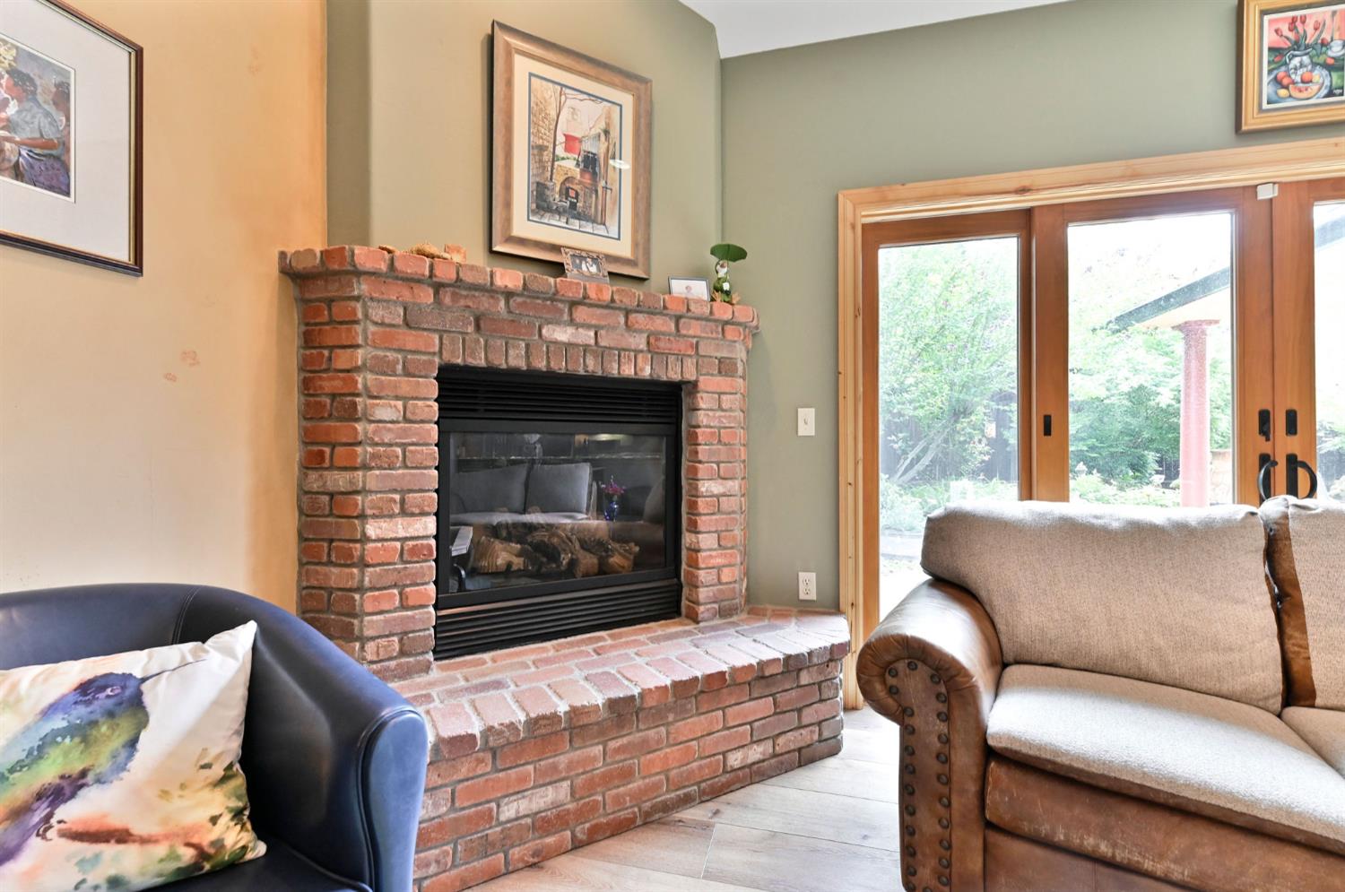 281 Oak Tree Circle Murphys, CA 95247 - Photo 36 of 96 a living room with furniture a fireplace and a large window