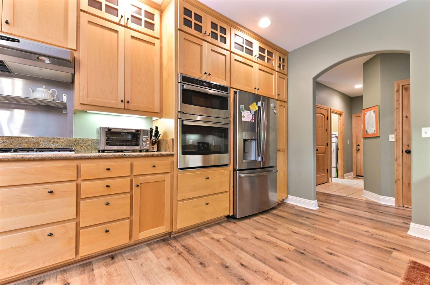 281 Oak Tree Circle Murphys, CA 95247 - Photo 46 of 96 a kitchen with stainless steel appliances granite countertop a refrigerator and cabinets