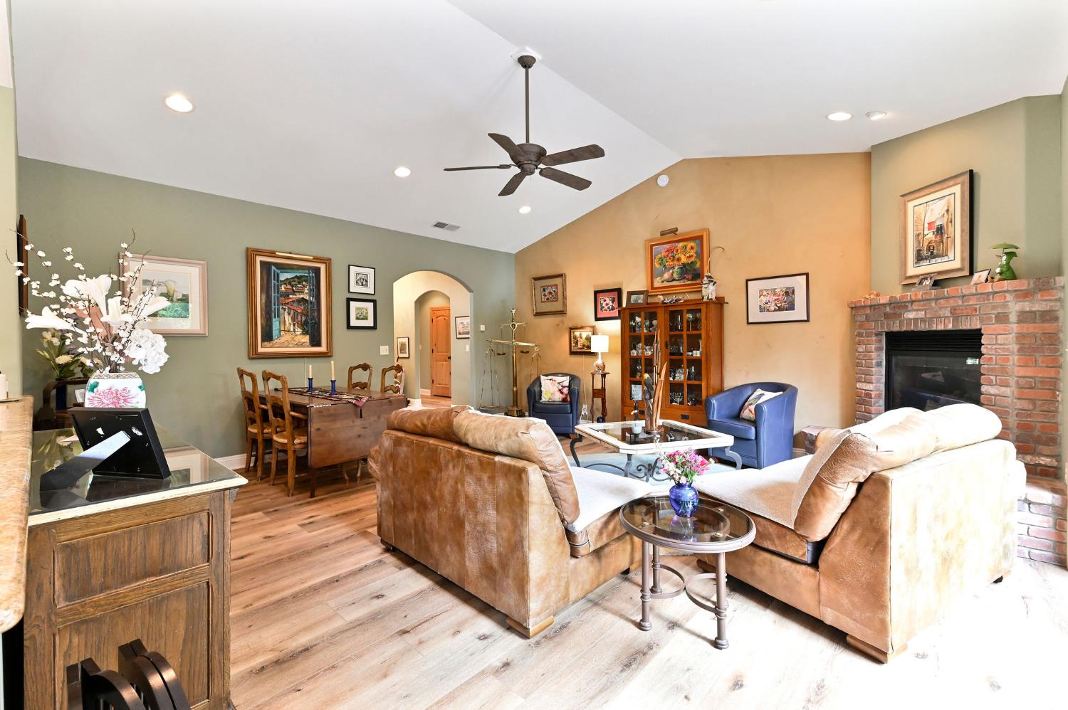 281 Oak Tree Circle Murphys, CA 95247 - Photo 5 of 96 a living room with fireplace furniture rug and wooden floor