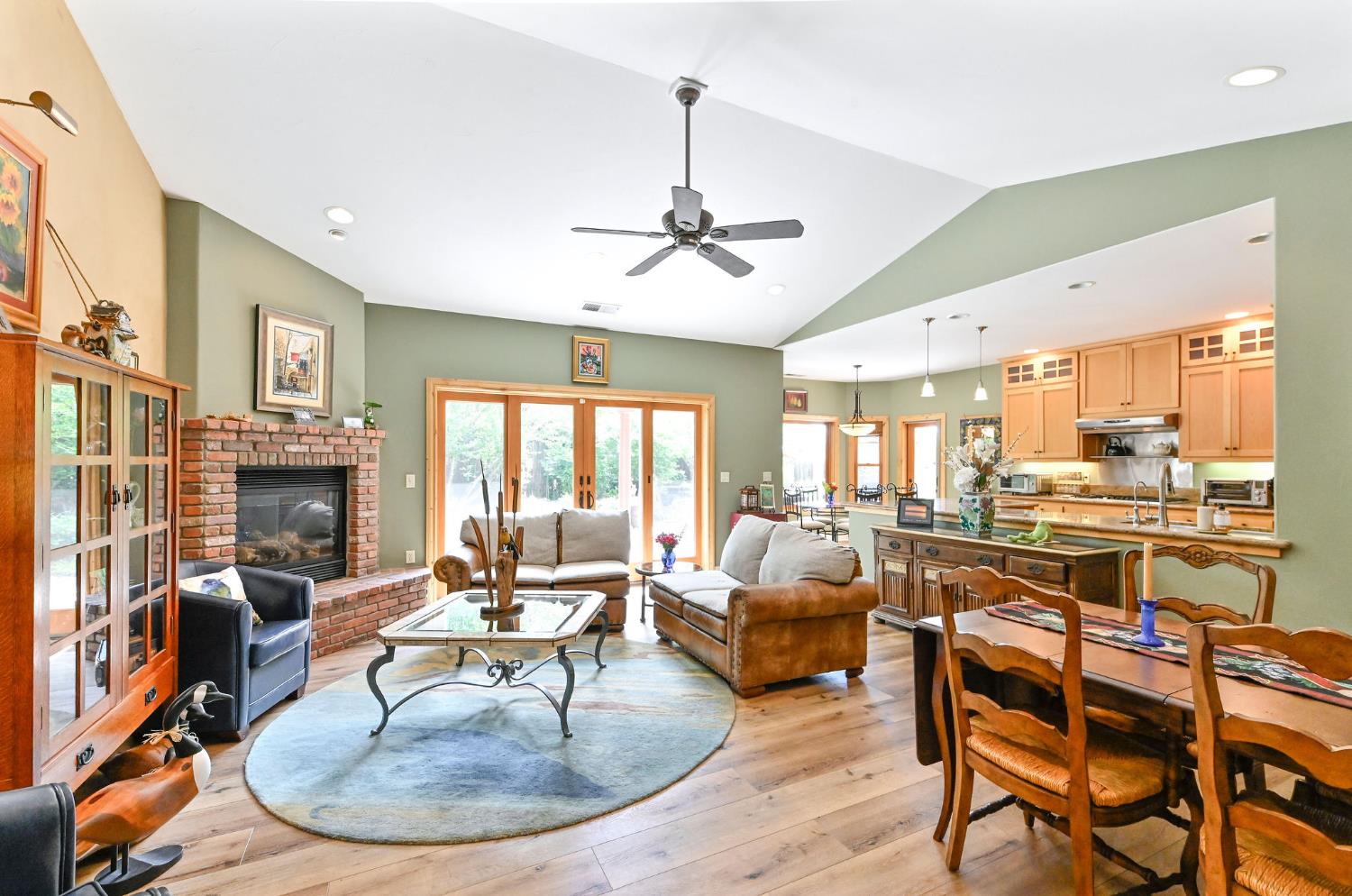 281 Oak Tree Circle Murphys, CA 95247 - Photo 7 of 96 a living room with fireplace furniture and a large window