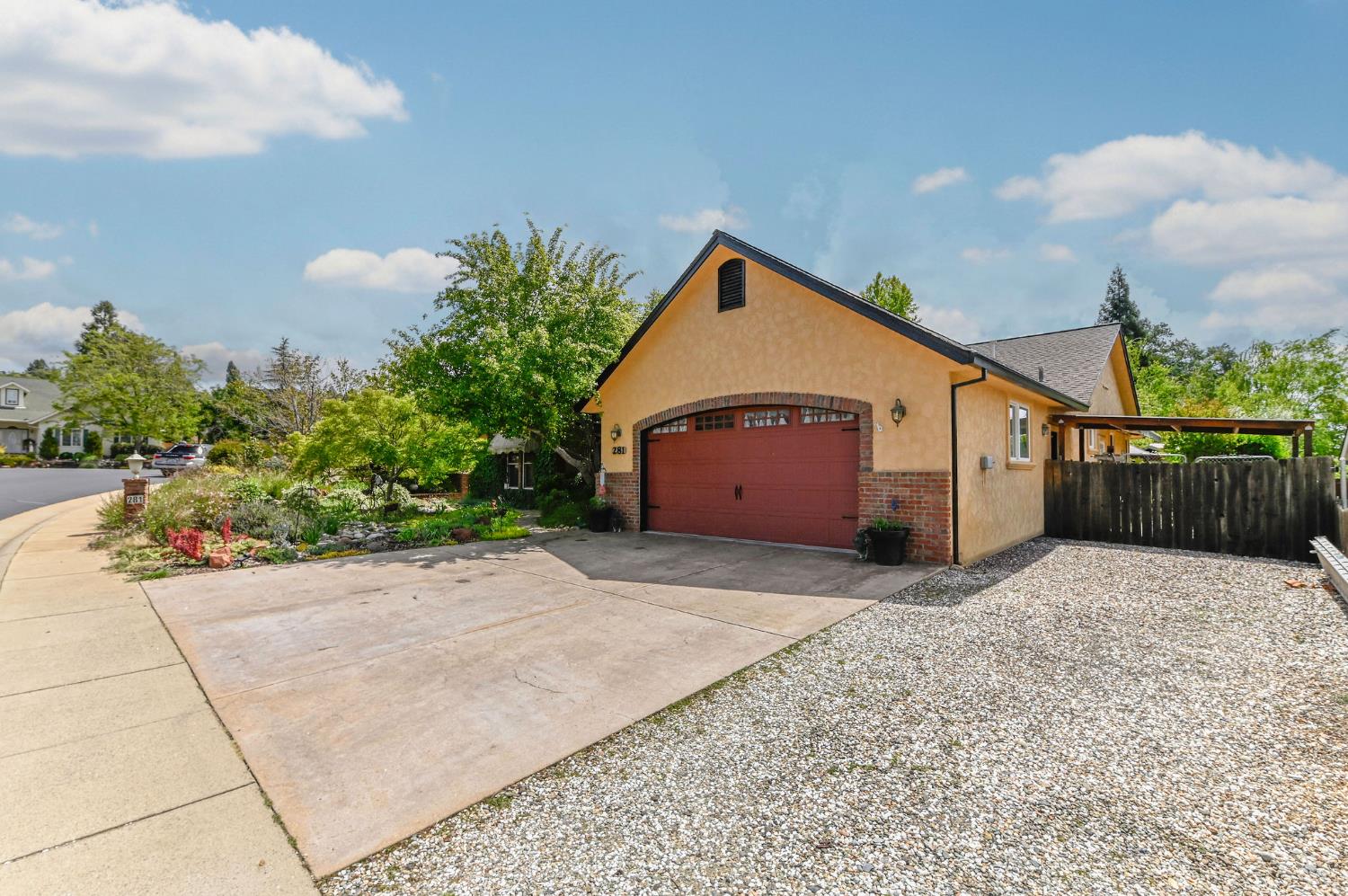 281 Oak Tree Circle Murphys, CA 95247 - Photo 79 of 96 a front view of a house with a yard and garage