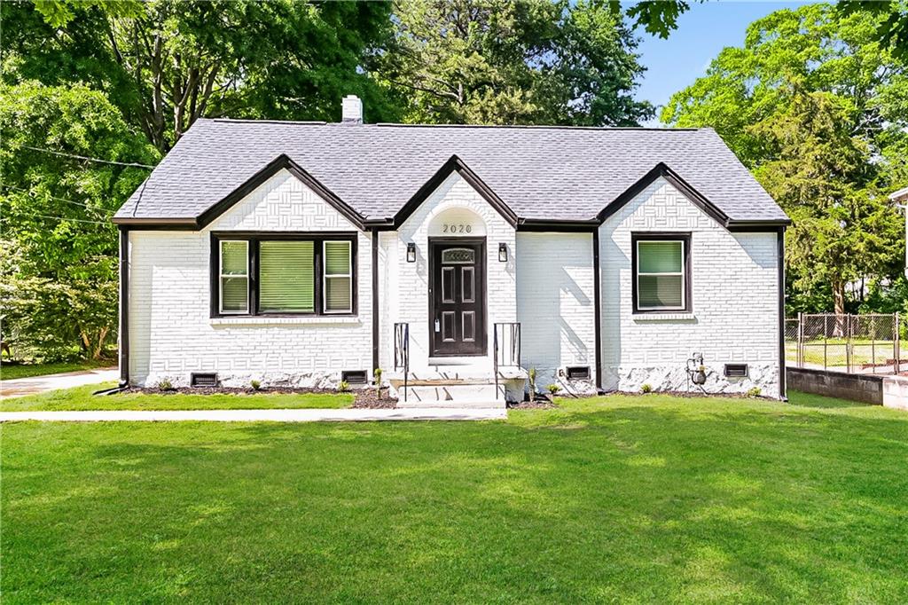 2020 McAfee Road Decatur, GA 30032 - Photo 1 of 1 a front view of a house with a yard