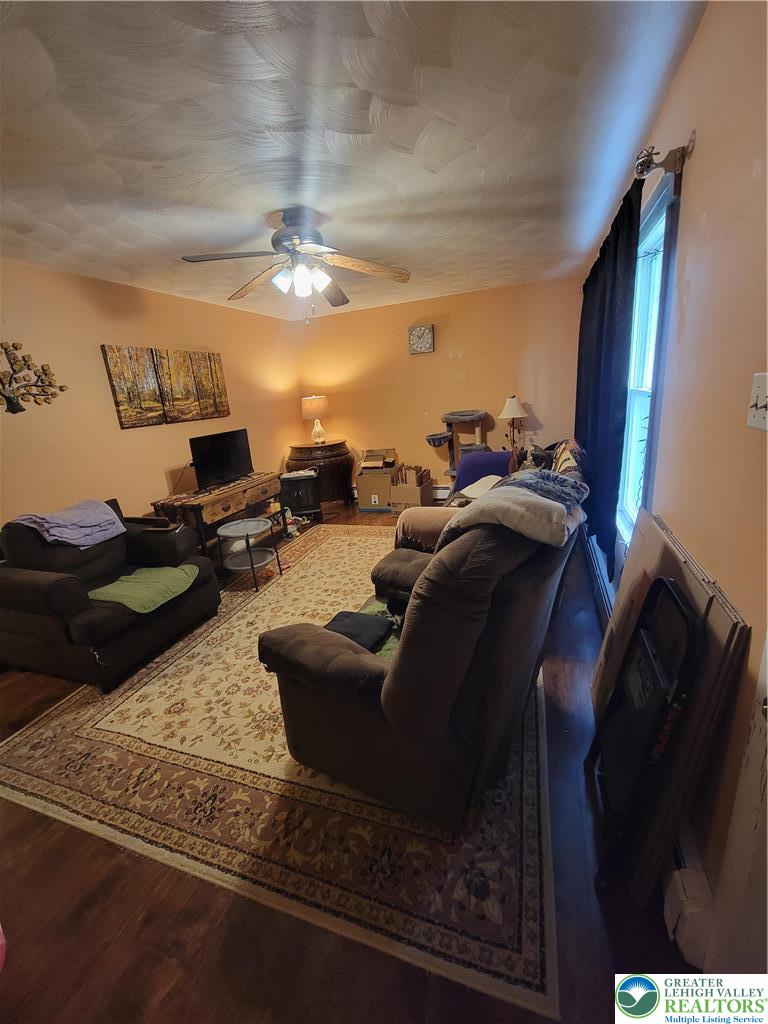 320 Hillside Street Forest City, PA 18421 - Photo 9 of 24 a living room with furniture and a chandelier