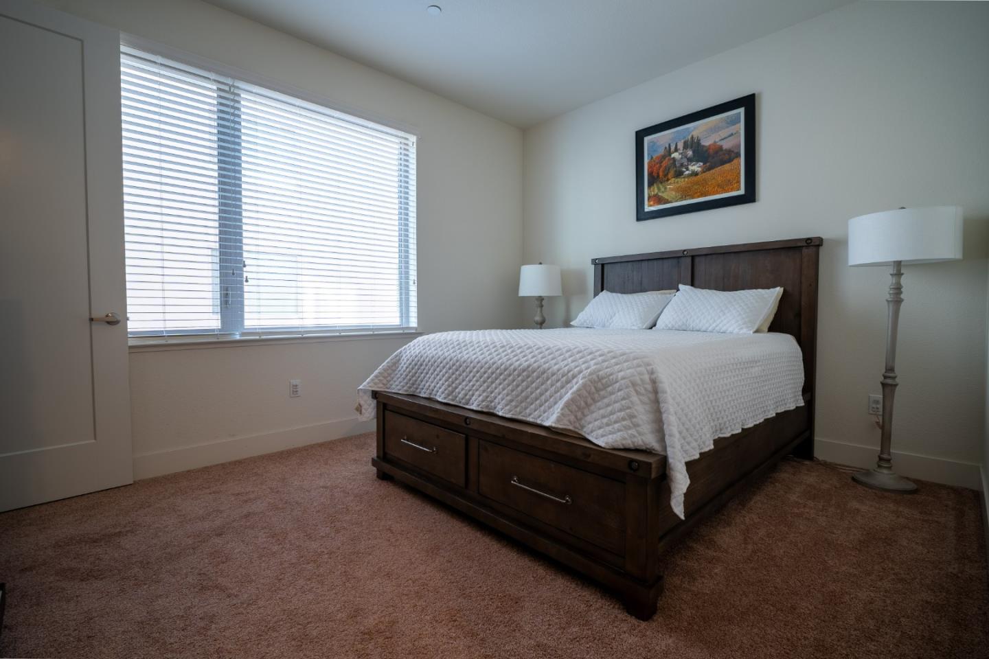 708 Eppleton Lane, Unit 204 Foster City, CA 94404 - Photo 30 of 46 a spacious bedroom with a bed and a window