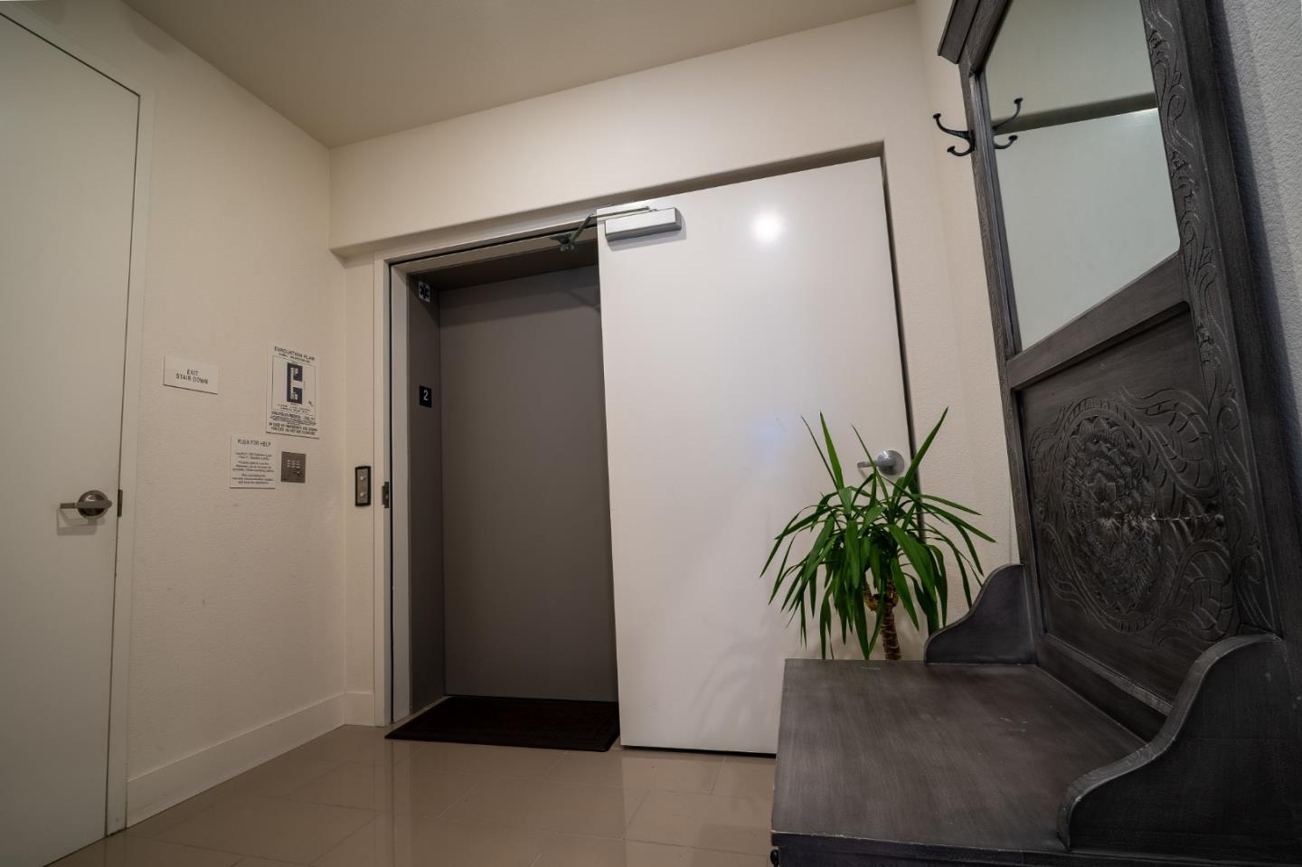 708 Eppleton Lane, Unit 204 Foster City, CA 94404 - Photo 3 of 46 a potted plant in a bathroom next to a glass door