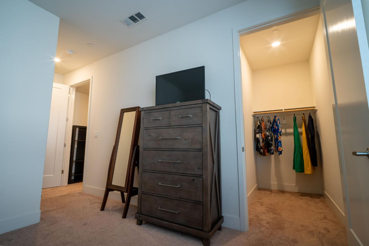 708 Eppleton Lane, Unit 204 Foster City, CA 94404 - Photo 32 of 46 a view of walk in closet with clothes and shoes