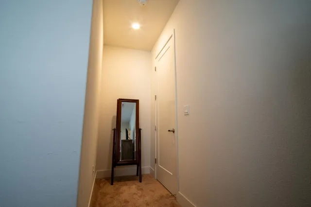 a view of hallway with closet