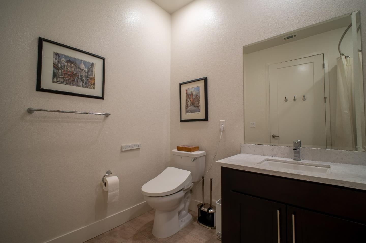 708 Eppleton Lane, Unit 204 Foster City, CA 94404 - Photo 35 of 46 a bathroom with a toilet a sink and mirror