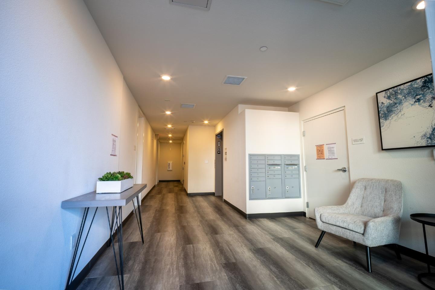 708 Eppleton Lane, Unit 204 Foster City, CA 94404 - Photo 40 of 46 a living room with furniture and a wooden floor