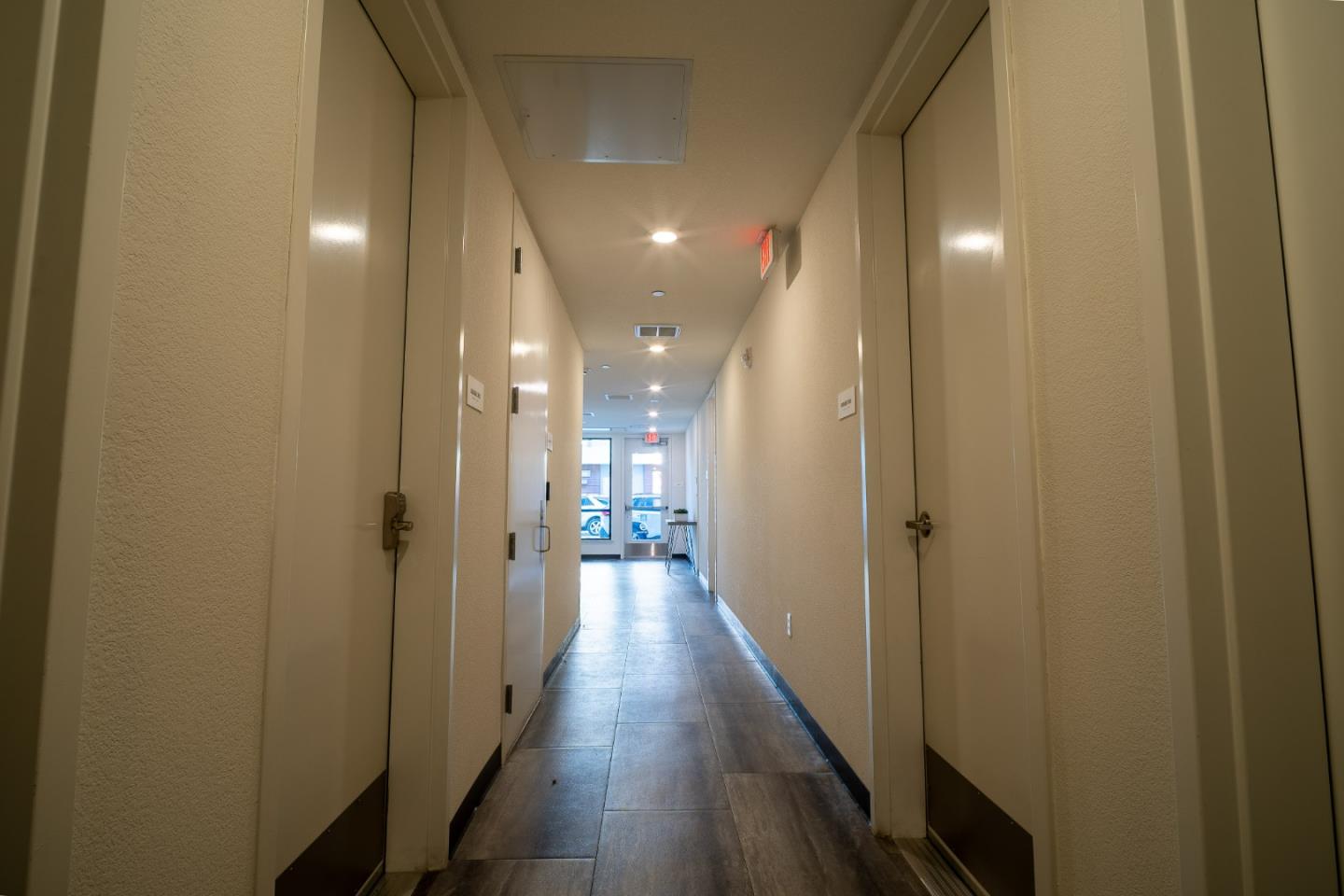 708 Eppleton Lane, Unit 204 Foster City, CA 94404 - Photo 42 of 46 a view of a hallway with wooden floor