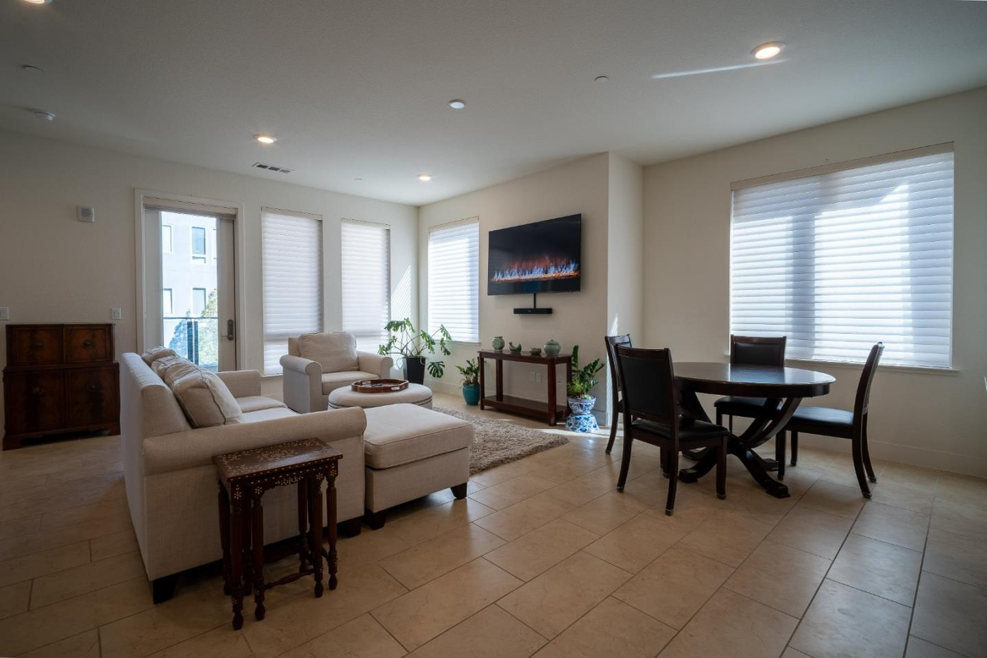 708 Eppleton Lane, Unit 204 Foster City, CA 94404 - Photo 7 of 46 a living room with furniture a flat screen tv and a window