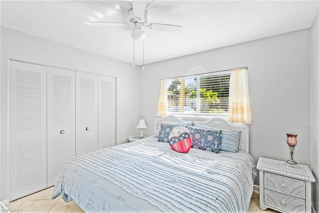 345 Joel Boulevard, Unit 110 Lehigh Acres, FL 33936 - Photo 15 of 47 a bedroom with a bed and a window