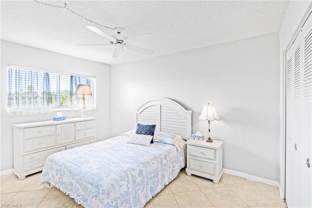 345 Joel Boulevard, Unit 110 Lehigh Acres, FL 33936 - Photo 18 of 47 a bedroom with a bed and a window