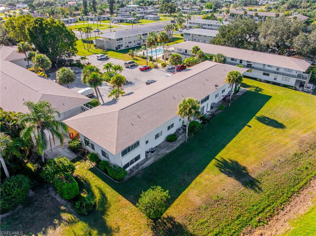 345 Joel Boulevard, Unit 110 Lehigh Acres, FL 33936 - Photo 33 of 47 an aerial view of a swimming pool