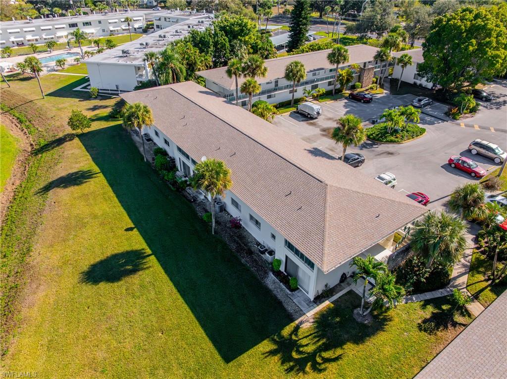 345 Joel Boulevard, Unit 110 Lehigh Acres, FL 33936 - Photo 34 of 47 an aerial view of a house with a yard basket ball court and outdoor seating