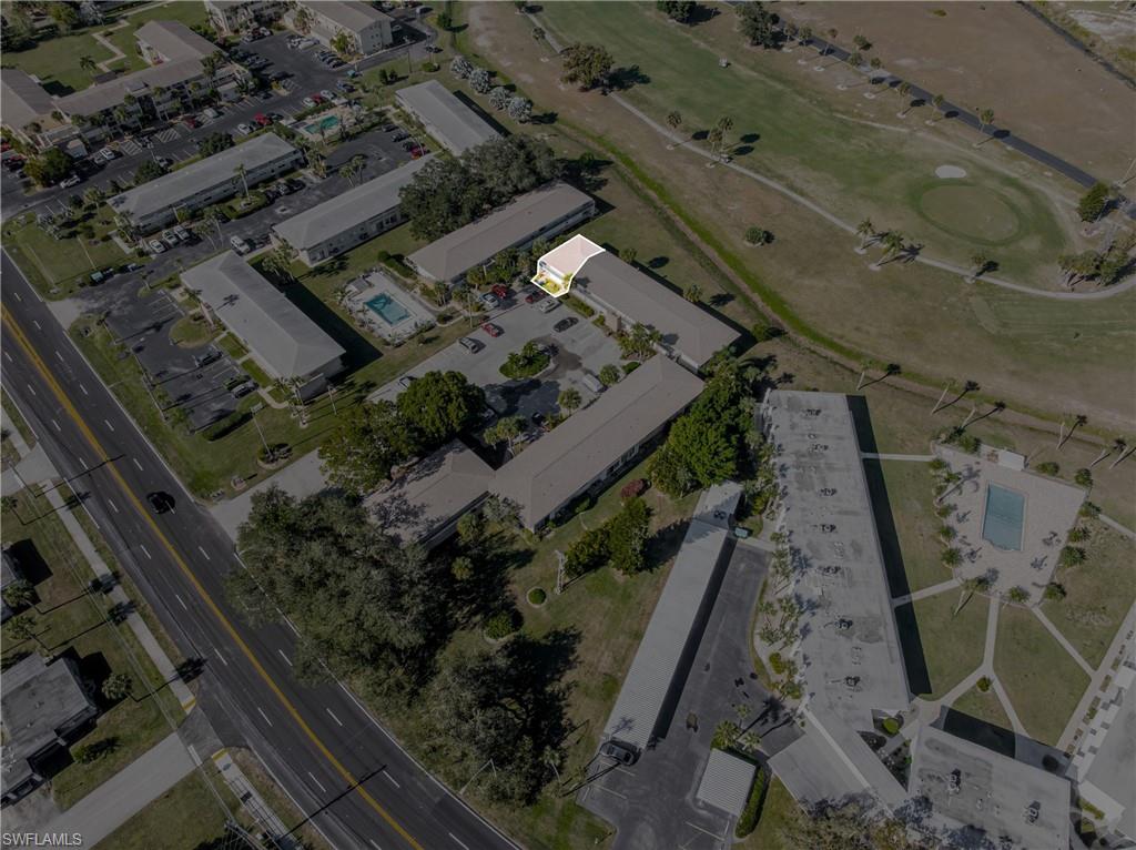 345 Joel Boulevard, Unit 110 Lehigh Acres, FL 33936 - Photo 39 of 47 a view of a backyard with wooden fence