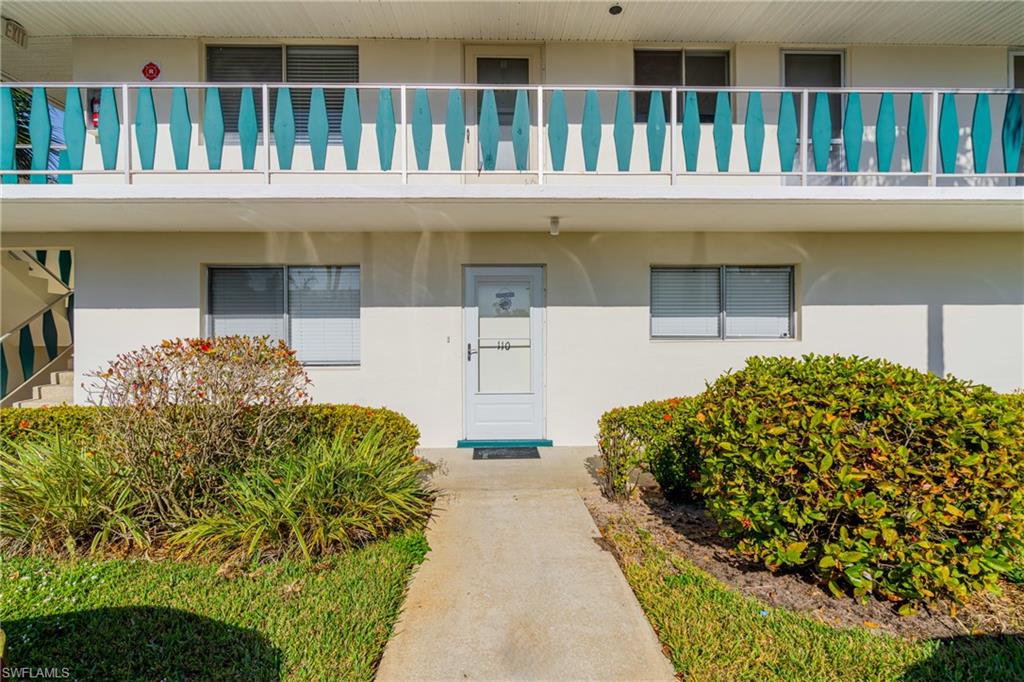 345 Joel Boulevard, Unit 110 Lehigh Acres, FL 33936 - Photo 8 of 47 a front view of a house