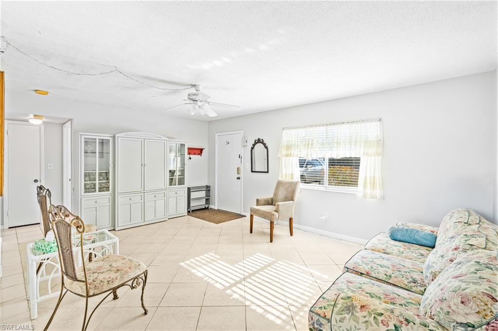 345 Joel Boulevard, Unit 110 Lehigh Acres, FL 33936 - Photo 10 of 47 a bedroom with furniture and a window