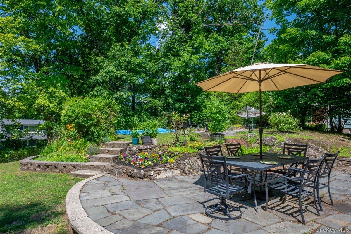 105 High St Extension Mount Kisco, NY 10549 - Photo 7 of 38 an outdoor space with furniture and umbrella